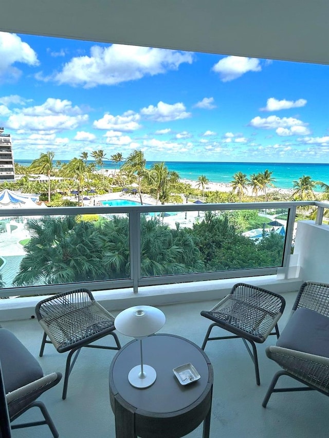 balcony featuring a water view