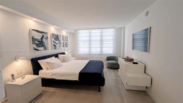 bedroom with light wood-style floors