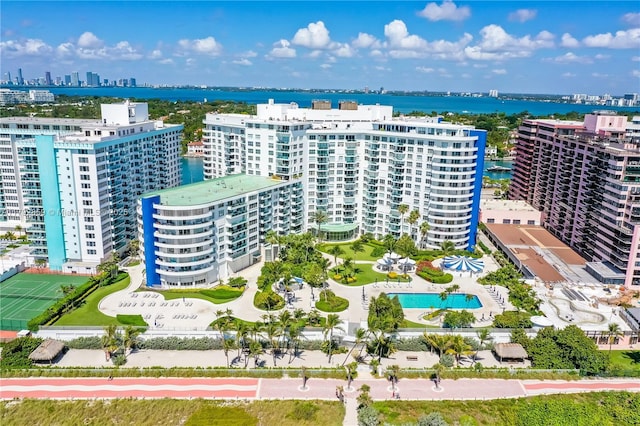 drone / aerial view featuring a water view and a city view