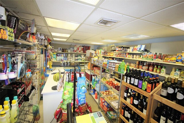 miscellaneous room with visible vents and a drop ceiling