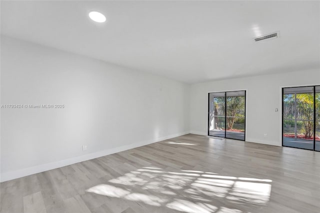 856 NW 47th St Unit 856, Deerfield Beach, FL 33064 - empty room with baseboards, wood finished floors, and visible vents