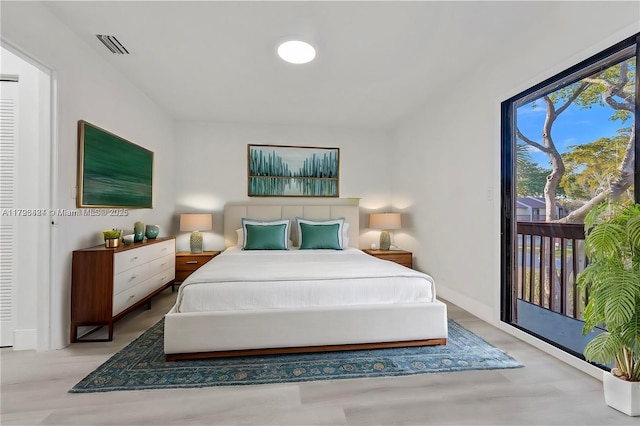 856 NW 47th St Unit 856, Deerfield Beach, FL 33064 - bedroom featuring access to outside, wood finished floors, and visible vents