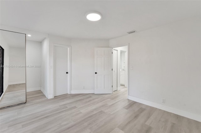 856 NW 47th St Unit 856, Deerfield Beach, FL 33064 - unfurnished bedroom with visible vents, light wood-type flooring, baseboards, a closet, and recessed lighting