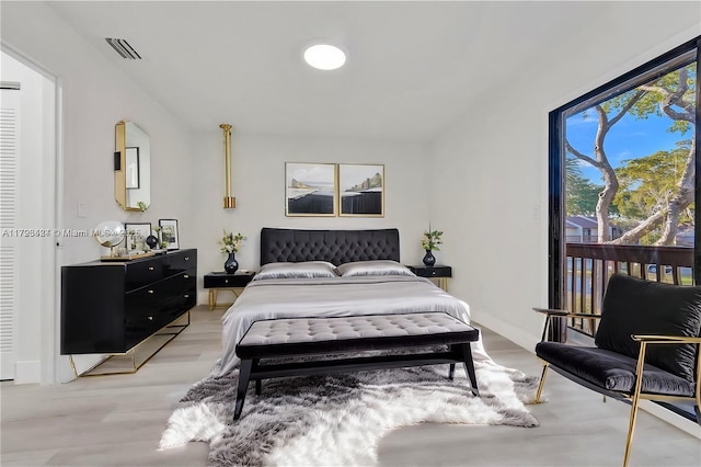 856 NW 47th St Unit 856, Deerfield Beach, FL 33064 - bedroom featuring light wood-style floors, access to outside, and visible vents