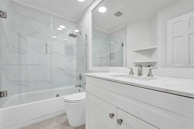 856 NW 47th St Unit 856, Deerfield Beach, FL 33064 - full bath featuring vanity, toilet, recessed lighting, combined bath / shower with glass door, and visible vents