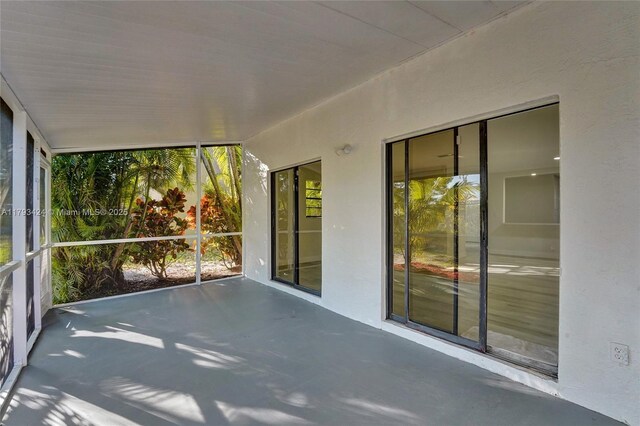 856 NW 47th St Unit 856, Deerfield Beach, FL 33064 - unfurnished sunroom with healthy amount of natural light and concrete floors