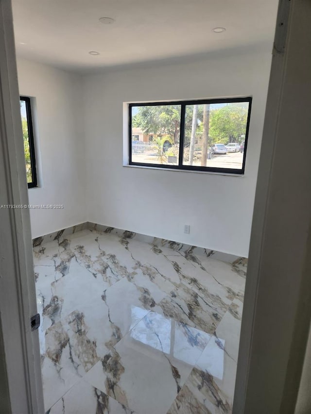 spare room with recessed lighting