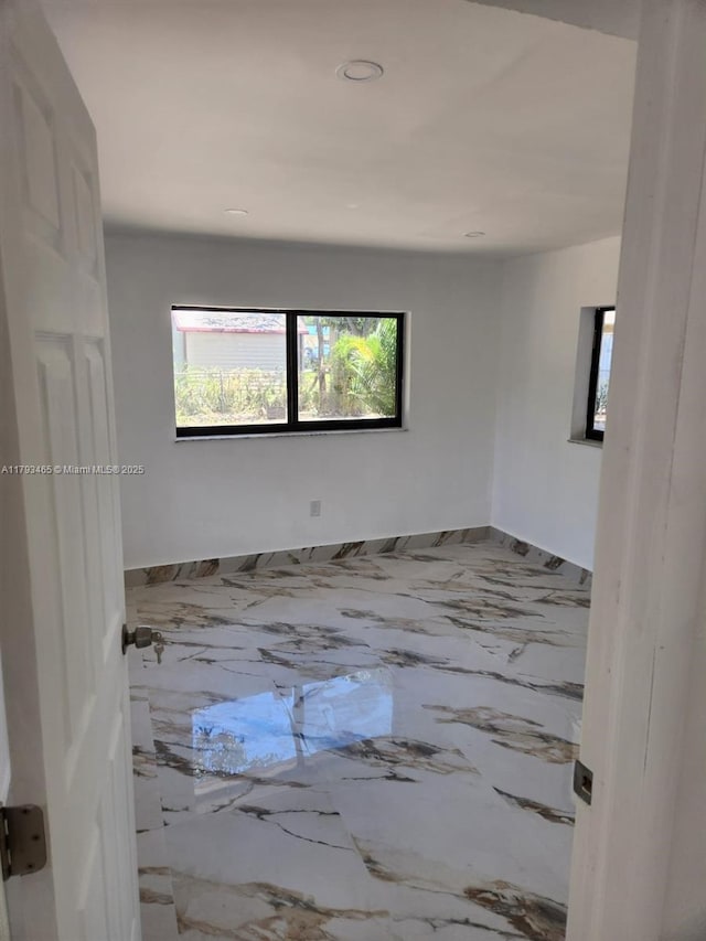 empty room with recessed lighting