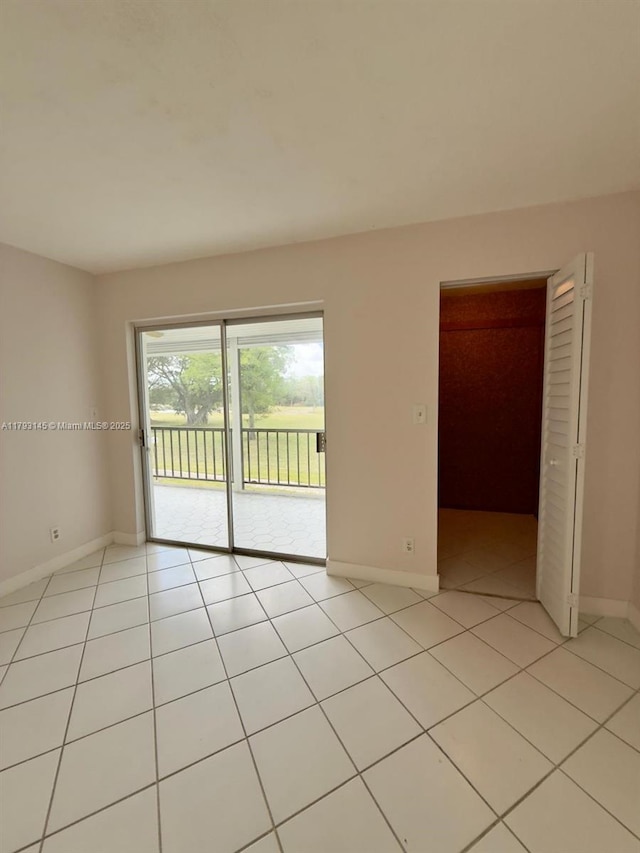 6080 NW 44th St Unit 205, Lauderhill, FL 33319 - unfurnished room featuring baseboards and light tile patterned floors