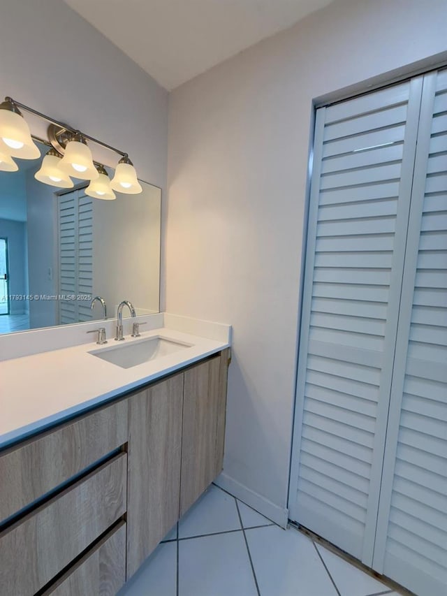 6080 NW 44th St Unit 205, Lauderhill, FL 33319 - bathroom featuring baseboards, tile patterned flooring, and vanity