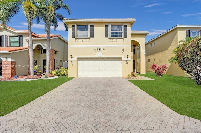 view of front of home featuring decorative driveway, a garage, a front lawn, and stucco siding