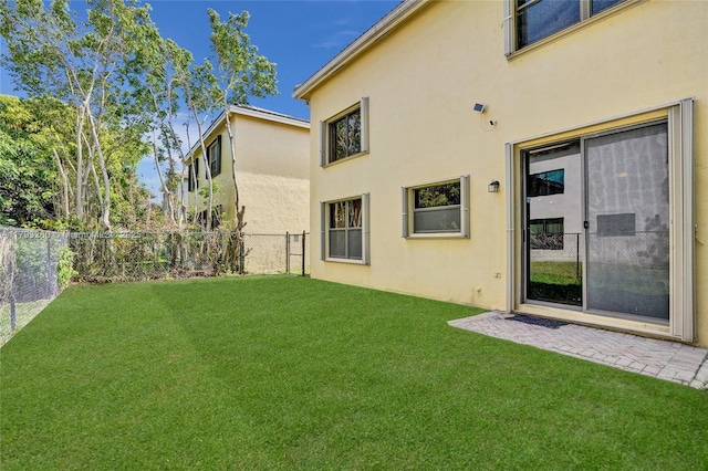 view of yard with a patio and fence