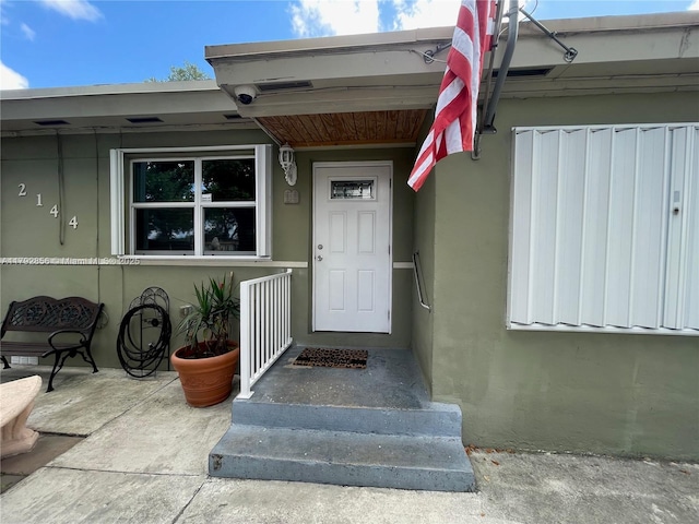 2144 NW 85th St, Miami, FL 33147 - doorway to property featuring stucco siding
