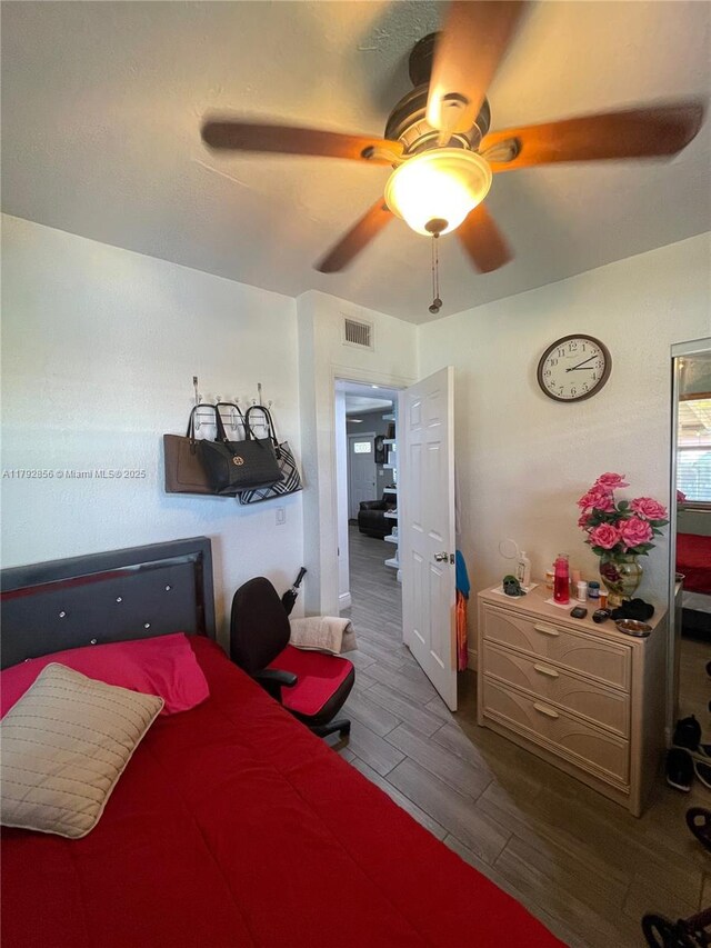 2144 NW 85th St, Miami, FL 33147 - bedroom featuring ceiling fan, wood finish floors, and visible vents