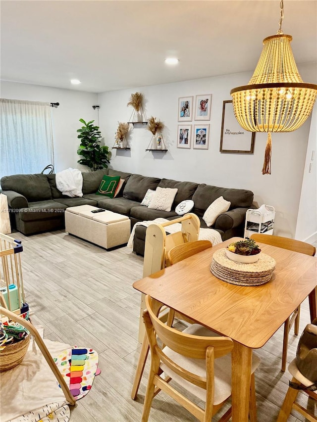 dining area featuring recessed lighting and light wood finished floors