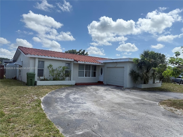 8940 Johnson St, Pembroke Pines, FL 33024 - view of front of house with driveway, a tile roof, a front yard, a garage, and stucco siding