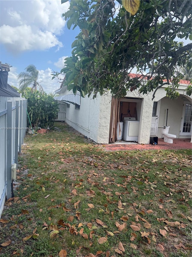 8940 Johnson St, Pembroke Pines, FL 33024 - view of yard with a fenced backyard and washer / dryer