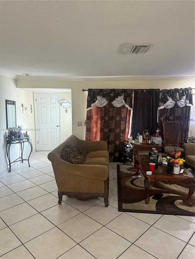 8940 Johnson St, Pembroke Pines, FL 33024 - living area featuring visible vents, ornamental molding, and light tile patterned floors