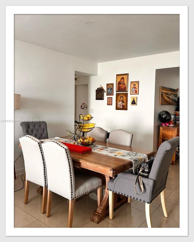 5825 Collins Ave Unit Ph1B, Miami Beach, FL 33140 - dining area featuring light tile patterned flooring