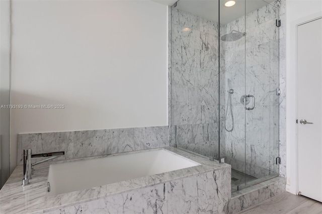 full bathroom with a marble finish shower, recessed lighting, and a bath