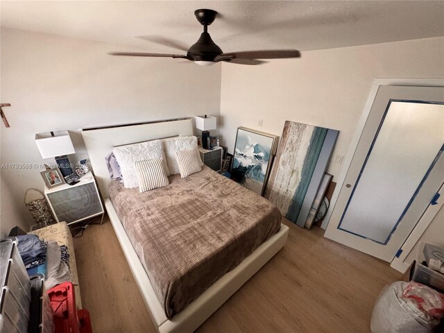 bedroom featuring a ceiling fan and wood finished floors