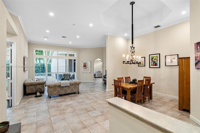 living area featuring crown molding, arched walkways, recessed lighting, baseboards, and visible vents