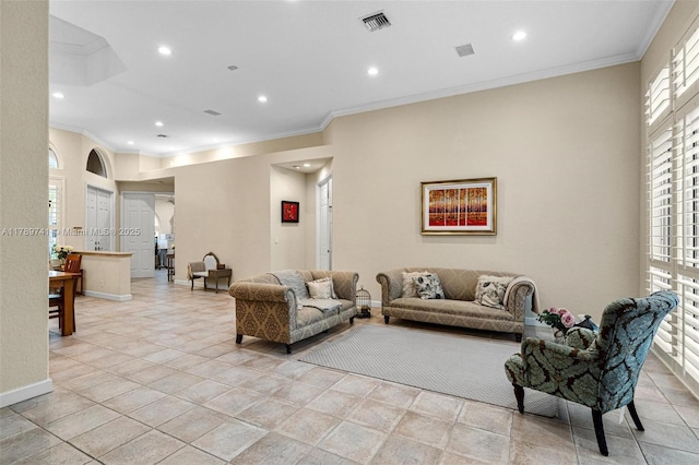 living area with recessed lighting, visible vents, and ornamental molding