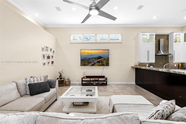 living area featuring recessed lighting, baseboards, and ornamental molding