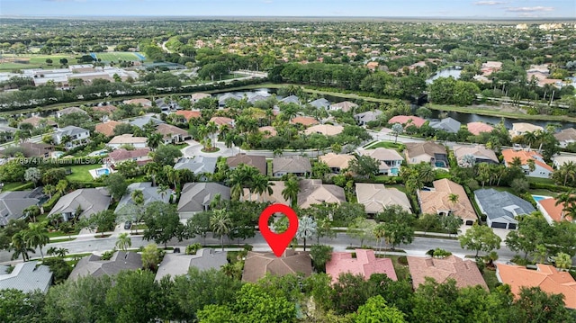 birds eye view of property featuring a residential view and a water view