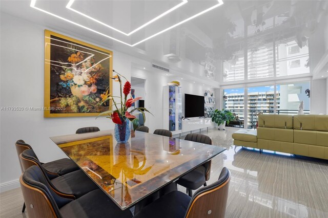 2030 S Ocean Dr Unit 2005, Hallandale Beach, FL 33009 - dining area featuring a high ceiling, visible vents, and baseboards