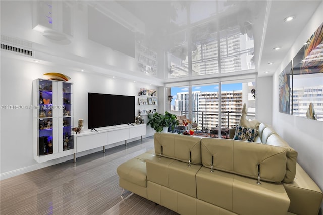2030 S Ocean Dr Unit 2005, Hallandale Beach, FL 33009 - living area featuring visible vents, a towering ceiling, wood finished floors, baseboards, and recessed lighting
