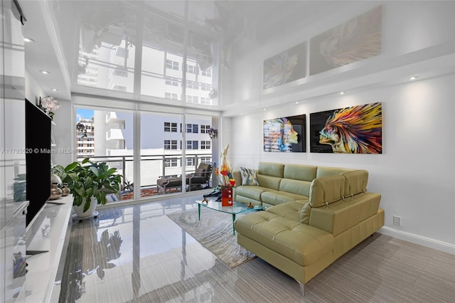 2030 S Ocean Dr Unit 2005, Hallandale Beach, FL 33009 - living area with baseboards and a towering ceiling