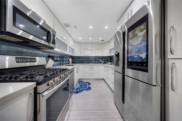 2030 S Ocean Dr Unit 2005, Hallandale Beach, FL 33009 - kitchen with a sink, appliances with stainless steel finishes, modern cabinets, and white cabinetry