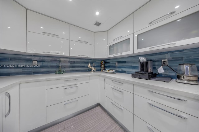 2030 S Ocean Dr Unit 2005, Hallandale Beach, FL 33009 - kitchen with white cabinets, visible vents, modern cabinets, and light countertops