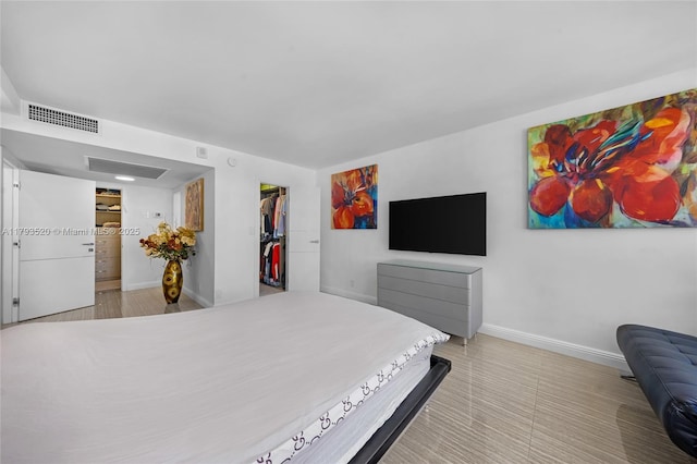 2030 S Ocean Dr Unit 2005, Hallandale Beach, FL 33009 - bedroom featuring visible vents, baseboards, a walk in closet, and a closet