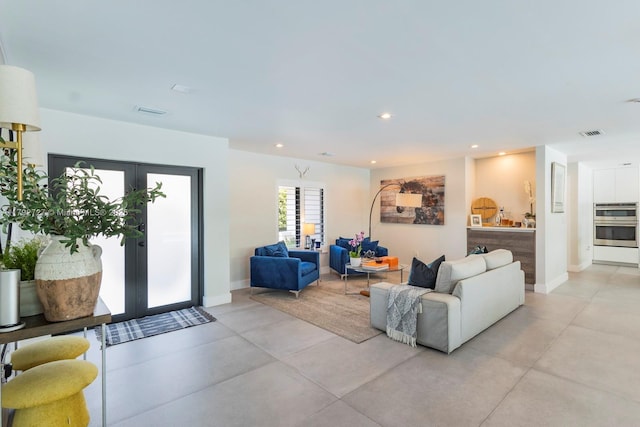 14405 SW 84th Ct, Palmetto Bay, FL 33158 - living area featuring french doors, concrete flooring, recessed lighting, and visible vents