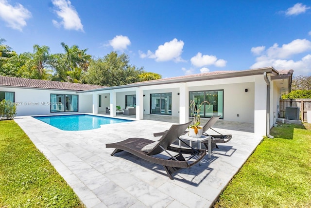 14405 SW 84th Ct, Palmetto Bay, FL 33158 - back of property featuring a yard, an outdoor pool, a patio area, and stucco siding