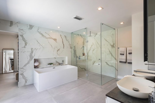14405 SW 84th Ct, Palmetto Bay, FL 33158 - bathroom with visible vents, tile walls, a marble finish shower, a soaking tub, and recessed lighting