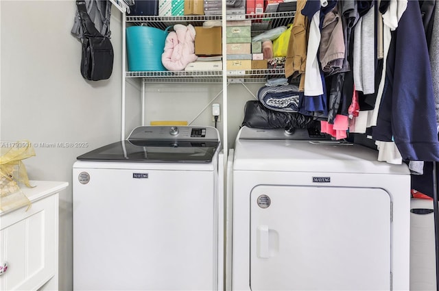 washroom with laundry area and washer and clothes dryer
