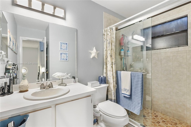 bathroom featuring vanity, a stall shower, and toilet