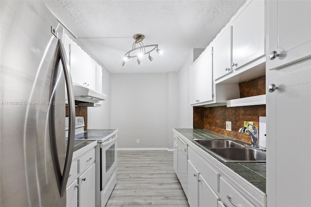 kitchen with open shelves, a sink, white cabinets, under cabinet range hood, and white appliances