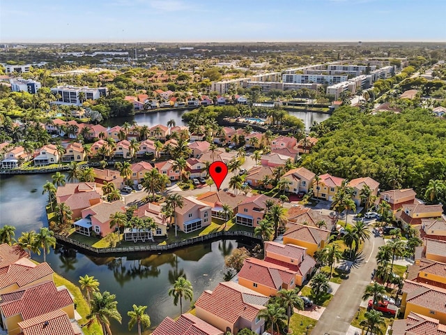 birds eye view of property featuring a water view and a residential view