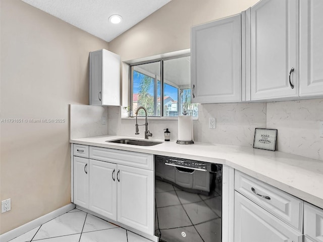 kitchen featuring backsplash, dishwasher, a sink, white cabinets, and marble finish floor