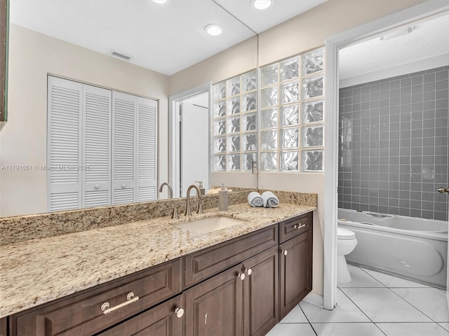 full bathroom with vanity, toilet, marble finish floor, tub / shower combination, and visible vents