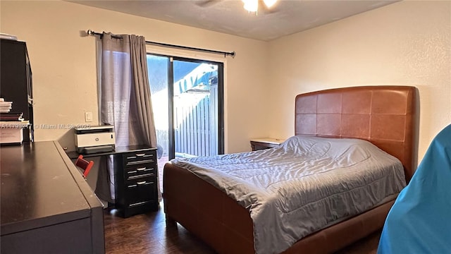 bedroom featuring ceiling fan and dark wood finished floors
