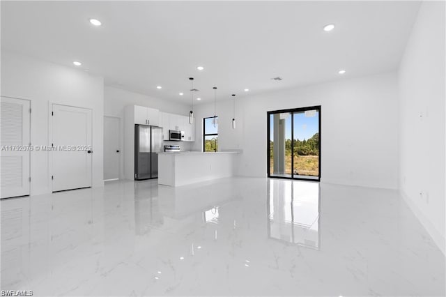 3203 Sunshine Blvd N, Lehigh Acres, FL 33971 - unfurnished living room featuring recessed lighting, marble finish floor, and baseboards