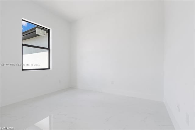 3203 Sunshine Blvd N, Lehigh Acres, FL 33971 - spare room featuring baseboards and marble finish floor