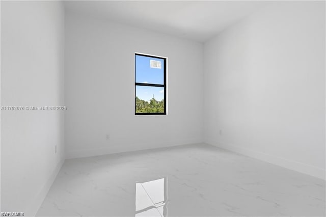 3203 Sunshine Blvd N, Lehigh Acres, FL 33971 - spare room with baseboards and marble finish floor