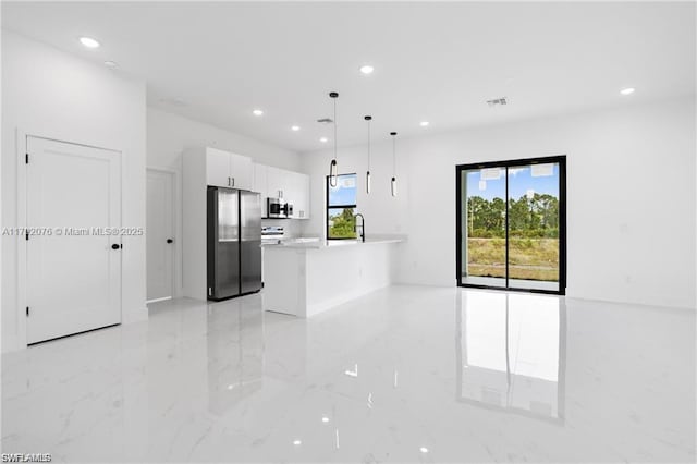 3203 Sunshine Blvd N, Lehigh Acres, FL 33971 - kitchen with appliances with stainless steel finishes, white cabinets, recessed lighting, and marble finish floor