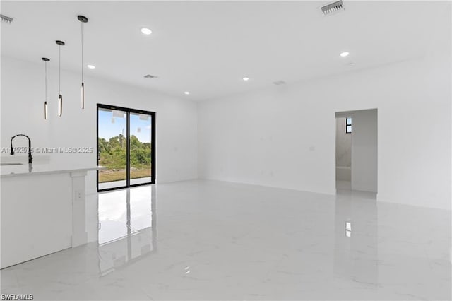 3203 Sunshine Blvd N, Lehigh Acres, FL 33971 - spare room featuring visible vents, recessed lighting, marble finish floor, and a sink